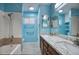 Bathroom with granite countertops, a walk-in shower, and stylish fixtures and a blue painted wall at 2902 E Escondido Ave, Mesa, AZ 85204