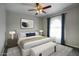 Comfortable bedroom featuring a ceiling fan, ample natural light, and neutral decor at 2902 E Escondido Ave, Mesa, AZ 85204