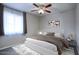 Cozy bedroom featuring a ceiling fan, neutral walls, plush carpet, and a window for natural light at 2902 E Escondido Ave, Mesa, AZ 85204