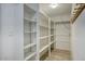 A storage room with built-in shelving units and plenty of space for organizing and storing items at 2902 E Escondido Ave, Mesa, AZ 85204