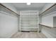 Bright walk-in closet with custom shelving and plenty of space for organizing clothes and accessories at 2902 E Escondido Ave, Mesa, AZ 85204