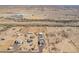 A sweeping aerial view of a horse property adjacent to local schools, and expansive desert landscapes at 29409 N 220Th Ave, Wittmann, AZ 85361