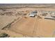 High aerial shot of horse property with an arena and shelters, showcasing the vastness of the land at 29409 N 220Th Ave, Wittmann, AZ 85361