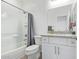 Neat bathroom featuring a shower-tub combo, toilet, and vanity with storage at 29409 N 220Th Ave, Wittmann, AZ 85361