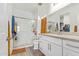 Modern bathroom with a glass-enclosed shower and a vanity with a granite countertop at 29409 N 220Th Ave, Wittmann, AZ 85361