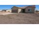 Well-maintained home with a large driveway and desert landscaping, in a tranquil setting at 29409 N 220Th Ave, Wittmann, AZ 85361