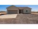 Inviting single-story home featuring a two-car garage, neutral tones, and desert landscape at 29409 N 220Th Ave, Wittmann, AZ 85361