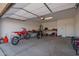 Spacious garage with overhead door and plenty of room for parking and storage at 29409 N 220Th Ave, Wittmann, AZ 85361