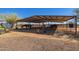 Well-maintained horse shelter with individual stalls for your animals at 29409 N 220Th Ave, Wittmann, AZ 85361