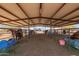 Well-equipped horse barn with multiple stalls and ample space at 29409 N 220Th Ave, Wittmann, AZ 85361