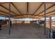 Interior view of horse barn, featuring multiple stalls at 29409 N 220Th Ave, Wittmann, AZ 85361