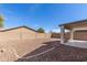 Low maintenance backyard, featuring a covered patio and desert landscaping at 30169 N Sunray Dr, San Tan Valley, AZ 85143