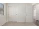 Bedroom featuring neutral carpeting, white walls and doors, and a window with blinds at 30169 N Sunray Dr, San Tan Valley, AZ 85143