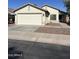 Charming single-story home featuring a two-car garage, desert landscaping, and a welcoming front entrance at 30169 N Sunray Dr, San Tan Valley, AZ 85143