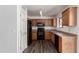 Well-lit kitchen with stainless steel appliances and wooden cabinets at 30169 N Sunray Dr, San Tan Valley, AZ 85143