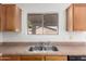 A close up shot of a double-basin stainless steel kitchen sink at 30169 N Sunray Dr, San Tan Valley, AZ 85143