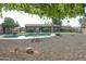 Backyard with a pool, dining area, and rock landscaping at 3119 S Stewart Cir, Mesa, AZ 85202