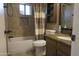 This bathroom includes a shower-tub combo, tile surround, and a vanity with granite countertop at 3119 S Stewart Cir, Mesa, AZ 85202