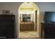 Bathroom with an archway, single sink vanity, tiled floors, and a view into the bedroom at 3119 S Stewart Cir, Mesa, AZ 85202