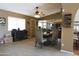 Dining area with a view into the updated kitchen featuring a center island and stainless steel appliances at 3119 S Stewart Cir, Mesa, AZ 85202