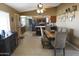 Open dining area with access to the kitchen, featuring stainless steel appliances and an island with seating at 3119 S Stewart Cir, Mesa, AZ 85202