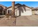 Charming single-story home featuring a two-car garage and desert landscaping at 3232 E Hononegh Dr, Phoenix, AZ 85050