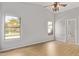 An empty main bedroom with gray walls and laminate flooring at 3232 E Hononegh Dr, Phoenix, AZ 85050