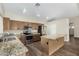 Well-lit kitchen featuring granite countertops, stainless steel appliances, and a functional center island at 3365 W Abraham Ln, Phoenix, AZ 85027