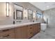 Modern bathroom with dual sinks, a soaking tub, and a glass-enclosed shower at 3511 E Orange Dr, Phoenix, AZ 85018