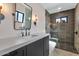 Chic bathroom showcasing a sleek glass shower, modern vanity, and stylish fixtures at 3511 E Orange Dr, Phoenix, AZ 85018