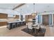 Spacious open concept featuring an oversized kitchen island with bar seating and a connected dining area at 3511 E Orange Dr, Phoenix, AZ 85018