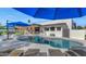 Inviting backyard pool with lounge chairs, umbrellas and a spa, perfect for relaxation at 3511 E Orange Dr, Phoenix, AZ 85018