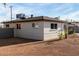 View of home's backyard featuring a gravel area and exterior made of grey brick at 3637 E Yale St, Phoenix, AZ 85008