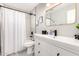 Bright bathroom with modern fixtures and a shower/tub combo with patterned tile floor at 3637 E Yale St, Phoenix, AZ 85008