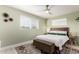 Well-lit bedroom featuring a large window, soft rug, and a comfortable bed at 3637 E Yale St, Phoenix, AZ 85008