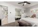 Neutral bedroom offering a large mirrored closet, ceiling fan, and ample natural light at 3637 E Yale St, Phoenix, AZ 85008