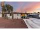 Charming single-story home with covered patio and spacious driveway at sunset at 3637 E Yale St, Phoenix, AZ 85008