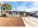 Charming single-story home with covered patio and spacious driveway under blue sky at 3637 E Yale St, Phoenix, AZ 85008