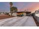 Charming single-story home with covered patio and spacious driveway at sunset at 3637 E Yale St, Phoenix, AZ 85008