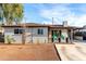 Charming single-story home with covered patio and spacious driveway with blue sky at 3637 E Yale St, Phoenix, AZ 85008