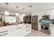 Open kitchen flows into the living area, featuring a large island and stainless steel appliances at 3637 E Yale St, Phoenix, AZ 85008