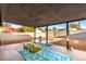 Relaxing covered patio with stylish outdoor furniture set on a colorful rug at 3637 E Yale St, Phoenix, AZ 85008