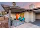 Inviting front porch with bright orange door, blue chairs, and stylish decor at 3637 E Yale St, Phoenix, AZ 85008