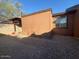 Backyard features a brick walkway, gravel and a window that lets natural light into the home at 3645 N 69Th Ave # 67, Phoenix, AZ 85033