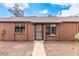 Exterior view of the home with a covered entryway and well-maintained landscaping at 3645 N 69Th Ave # 67, Phoenix, AZ 85033