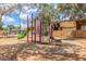 Community playground featuring climbing structures and a swing at 3645 N 69Th Ave # 67, Phoenix, AZ 85033