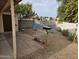 Backyard featuring desert landscaping, gravel, brick pathway, and patio area at 3706 S Dennis Dr, Tempe, AZ 85282