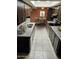 Kitchen and dinette area featuring dark cabinetry, granite countertops, and stainless steel appliances at 3706 S Dennis Dr, Tempe, AZ 85282