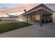 Covered patio transitions to artificial turf and gravel landscaping at 3803 S Elm St, Tempe, AZ 85282