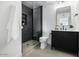 Modern bathroom featuring a glass-enclosed shower, sleek vanity, and contemporary fixtures at 3803 S Elm St, Tempe, AZ 85282